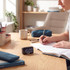 Digital timer clock on desk beside notebooks and stationery in study setting