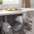 Grey roasting tray and plates in dishwasher, showing easy cleaning feature