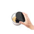 Hand placing black lid on clear food processor bowl with blended mixture inside