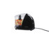 Black mini food chopper with clear bowl, filled with chopped vegetables, on white background