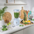 Close-up of blue electric kitchen appliance with chrome dial