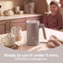 Salter milk frother on kitchen counter with hot drink