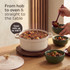 Cream cast iron casserole dish with lid and gold knob on wooden worktop