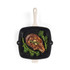 Cream handled grill pan with cooked steak and broccoli, top view