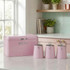 Pink bread bin and matching tea, coffee, sugar canisters on kitchen counter