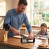 Kitchen scene with Salter knife sharpener in use, knife block visible on countertop.