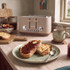 Mocha four-slice toaster on kitchen counter with toast and jam
