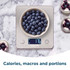 Silver digital kitchen scale weighing a bowl of blueberries