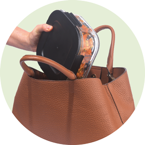 food container being put inside a handbag