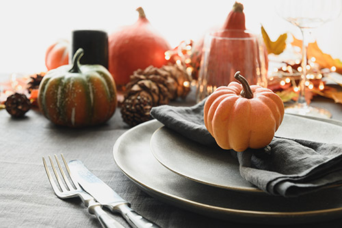 2 small pumpkins on a table