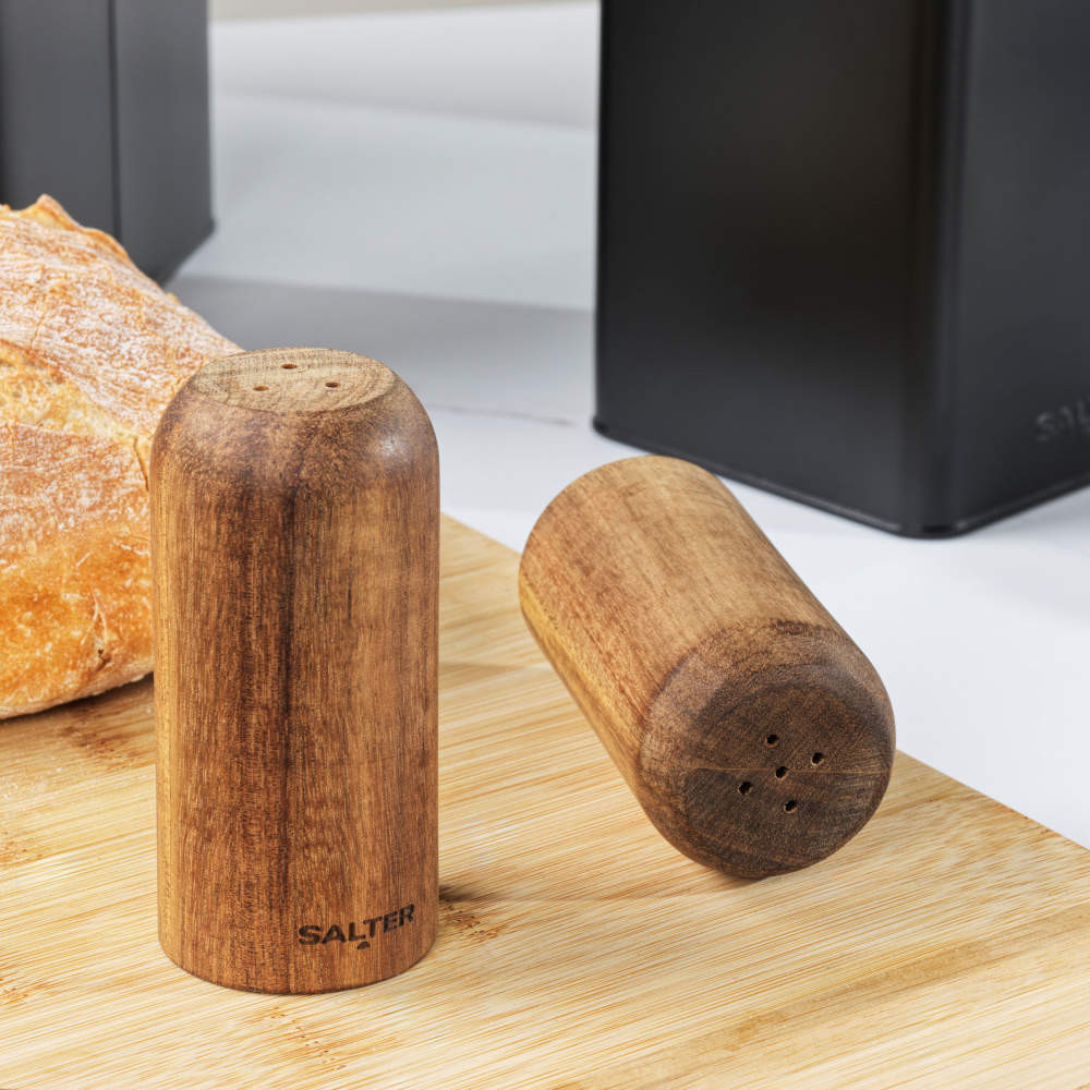 Set of two wooden Salter salt and pepper shakers on board