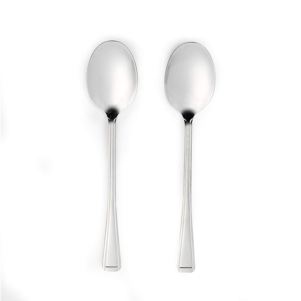 Pair of silver dessert spoons with straight handles on white background