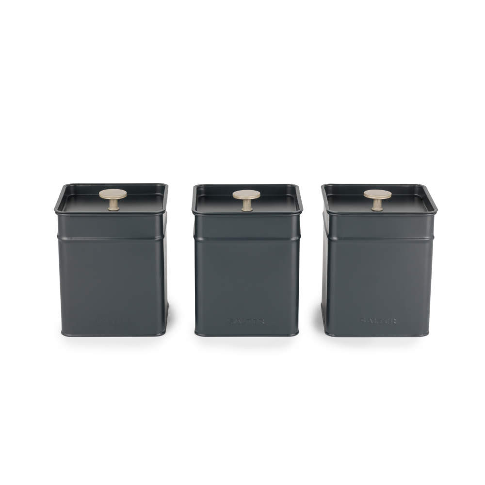 Set of three grey square storage canisters with silver knobs, for tea, coffee, and sugar.