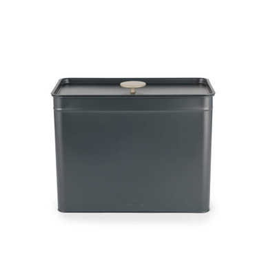 Black metal storage tin with flat lid and round handle, displayed front facing.
