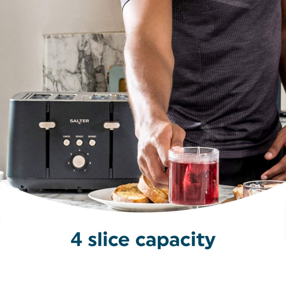 Grey 4-slice toaster on kitchen counter with toast and hot drink