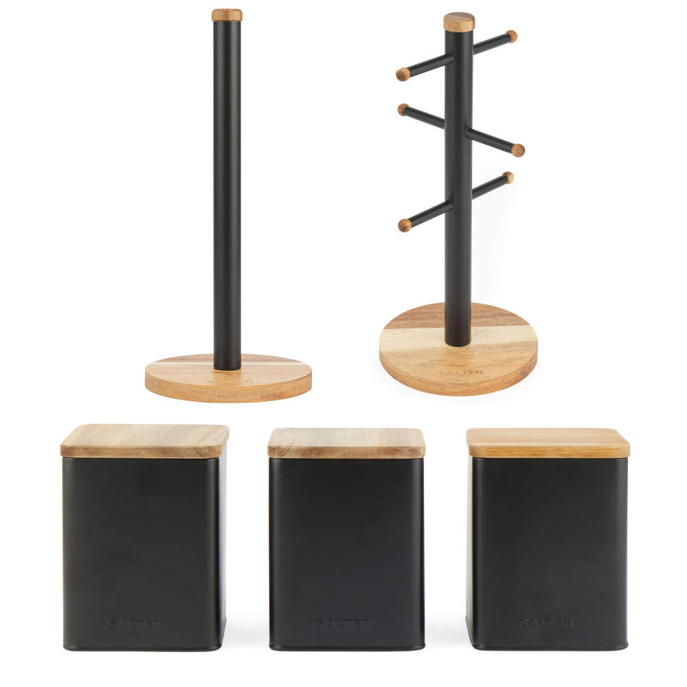 Set of three black kitchen storage canisters with matching mug tree and towel holder, wood accents