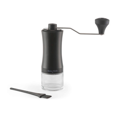Black manual coffee grinder with glass base and cleaning brush