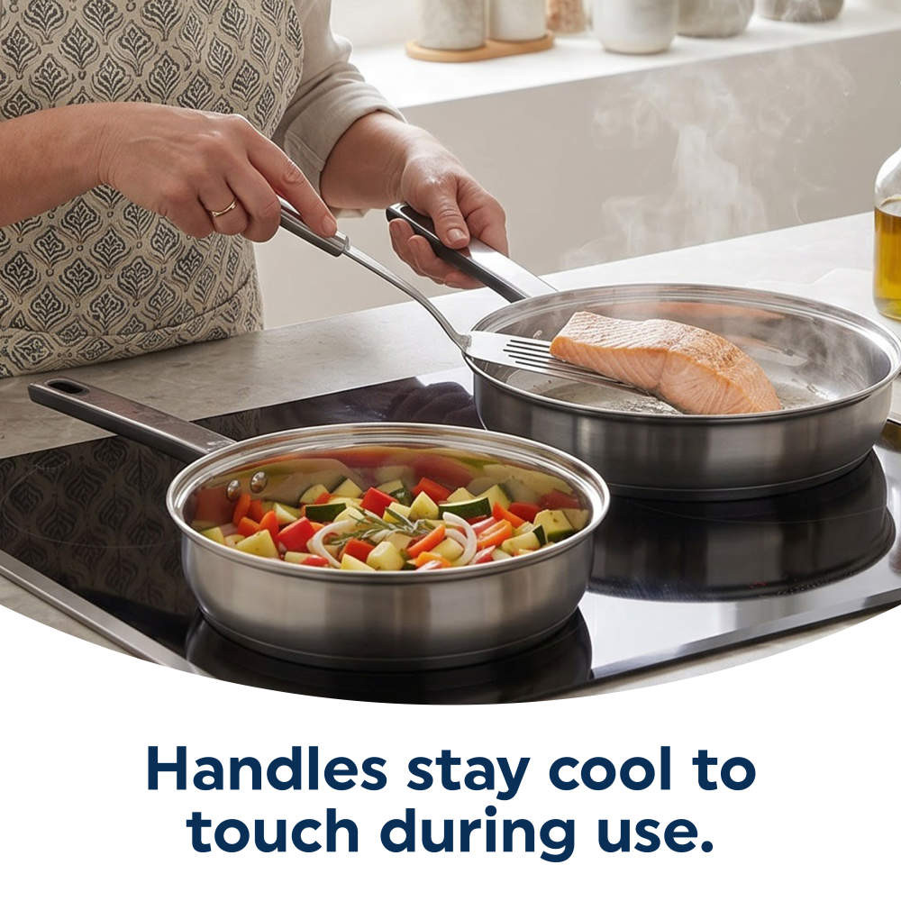 Stainless steel frying pans with heat-resistant handles, one with salmon, one with mixed vegetables.