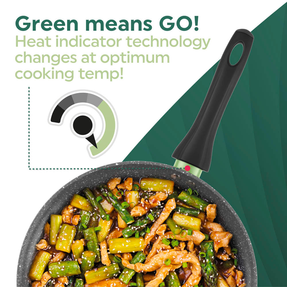 Non-stick frying pan with heat indicator and stir-fry, handle glows green at cooking temperature