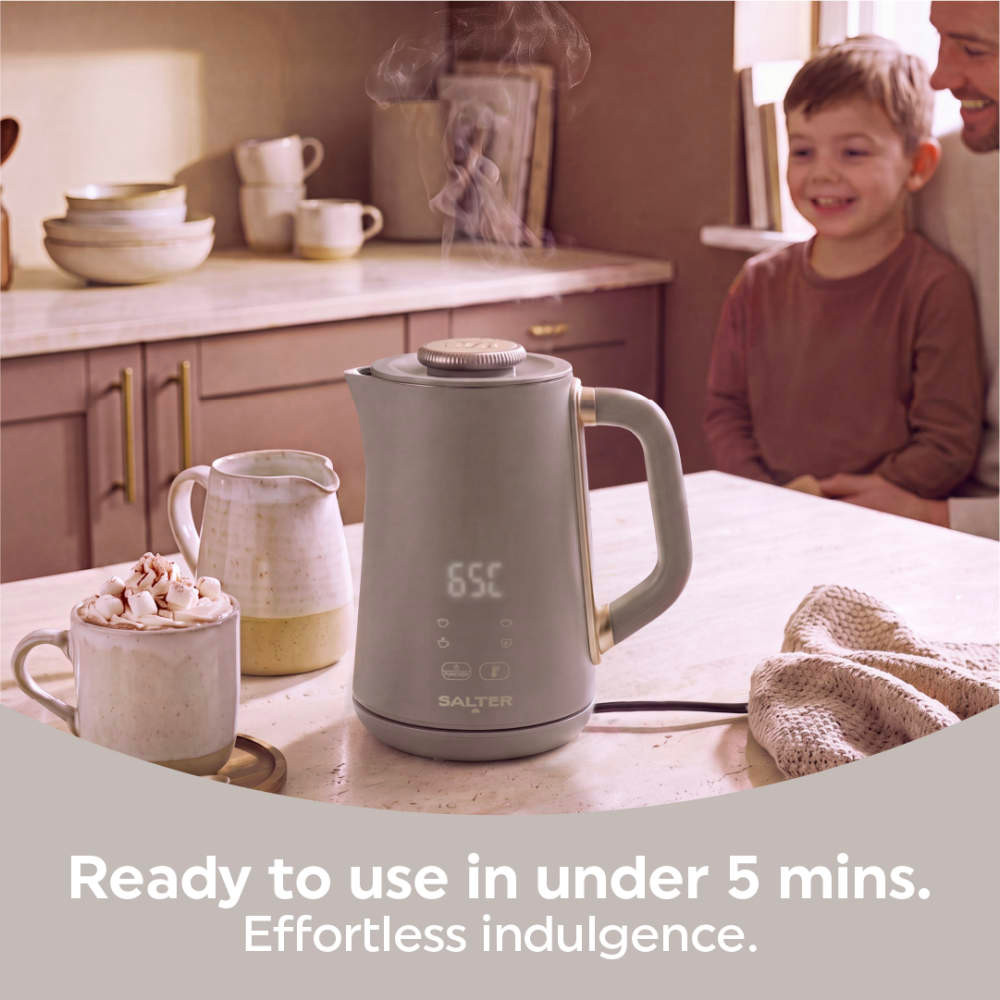 Salter grey hot chocolate maker on kitchen counter with steaming drink beside it