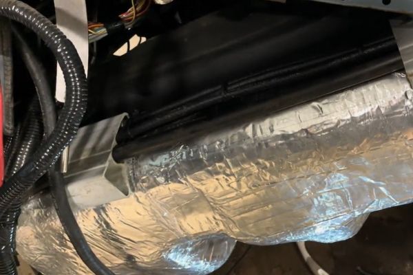 fuel tank wrapped with thermal block heat shield