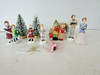 LEMAX CAROLER PORCELAIN FIGURINES & EXTRAS WITH 4 SNOW COVERED PINES ASST  H5