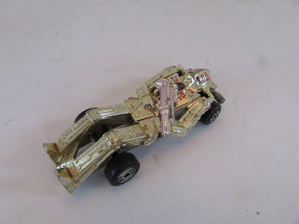 DIECAST MATTEL HOT WHEELS 1988 ZOMBOT CAR GOLD WITH PINK GUN