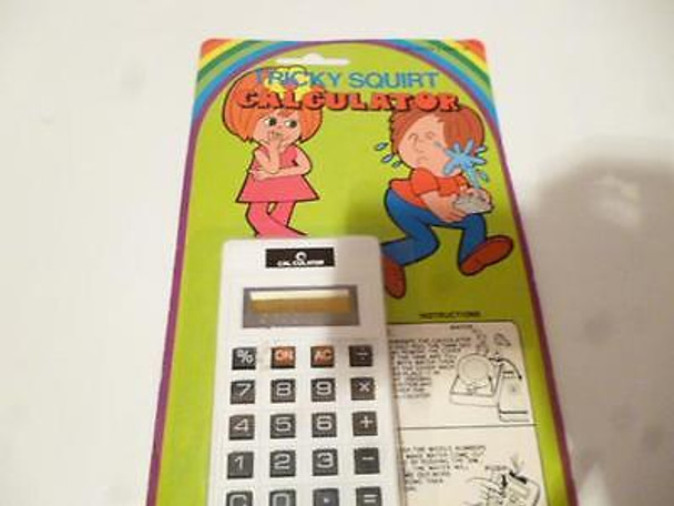 OLDER TOY -TRICKY SQUIRTING CALCULATOR- MINT   STILL SEALED H25