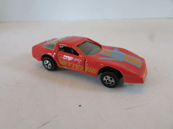 DIECAST CAR ROAD CHAMPS 1985 CORVETTE ORANGE W/STRIPING