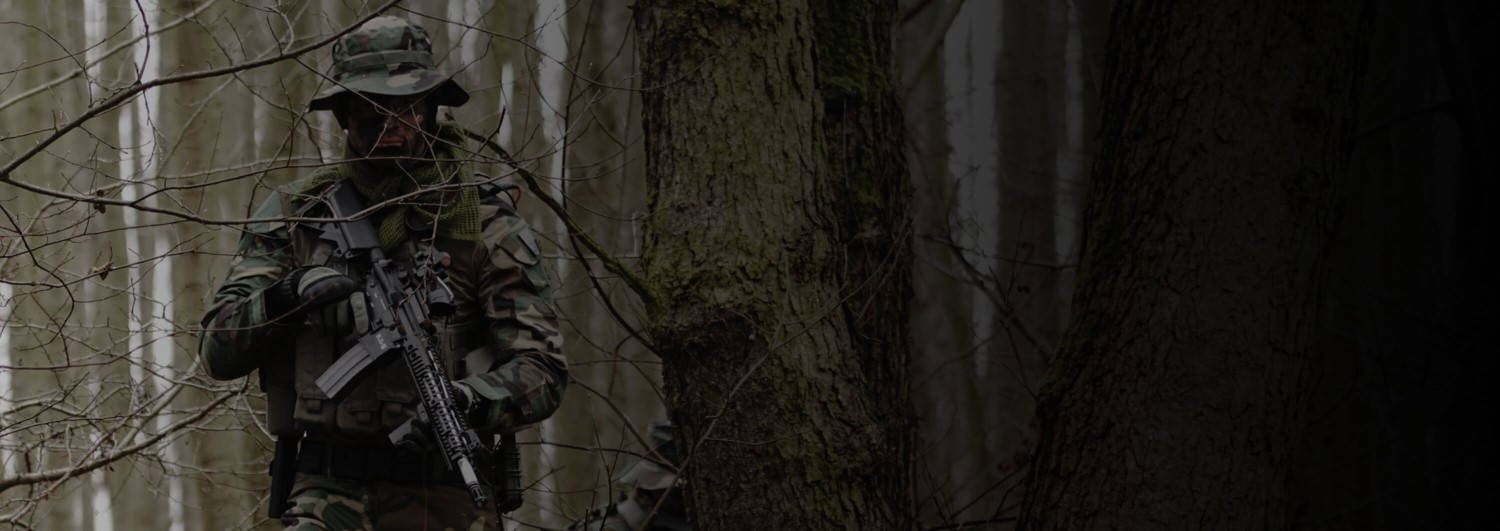 Military Man Walking Through Terrain
