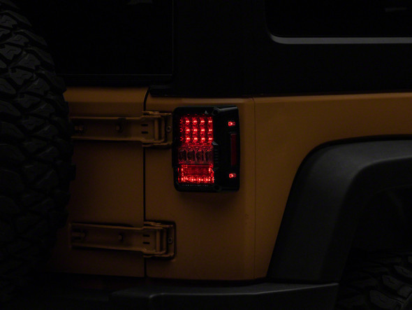Raxiom 07-18 Jeep Wrangler JK Axial Series Lux LED Tail Lights- Black Housing (Clear Lens) - MSM-T-597880