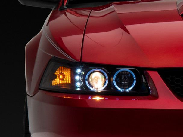 Raxiom 99-04 Ford Mustang Dual LED Halo Projector Headlights- Black Housing (Clear Lens) - MSM-T-547969