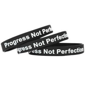 3 of Progress Not Perfection Wristbands