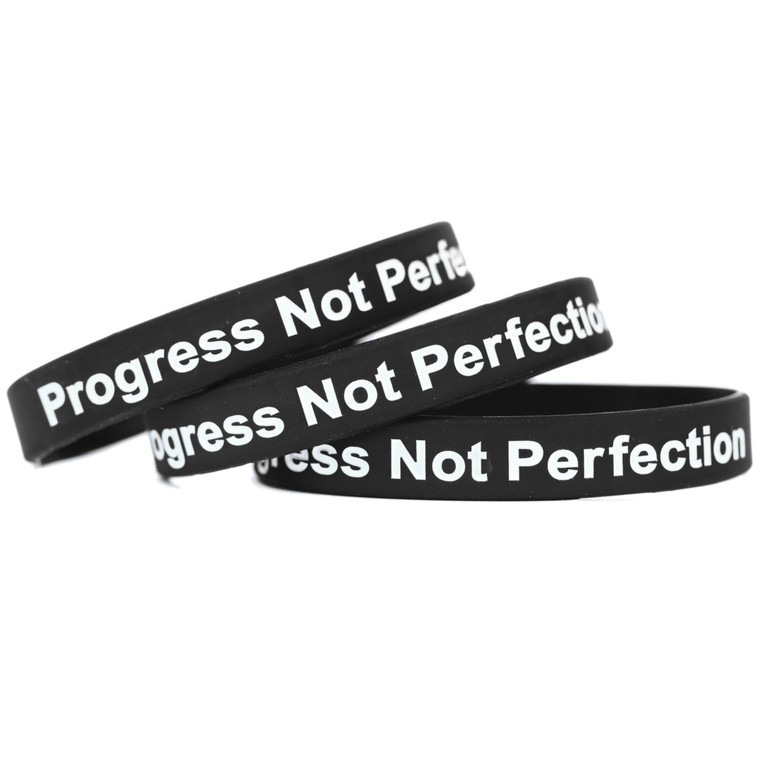 3 of Progress Not Perfection Wristbands