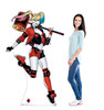 Life-size cardboard standee of Harley Quinn with model.