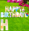 Coroplast colored circles Happy Birthday yard signs with background.