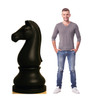 Life-size cardboard standee of Chess Knight Black with model.