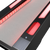 Close up of the ramp of a Skee-Ball Glow arcade game, black outside, blue ramp, and bright red lights along the sides