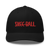 Front of black trucker hat with modern Skee-Ball logo in red