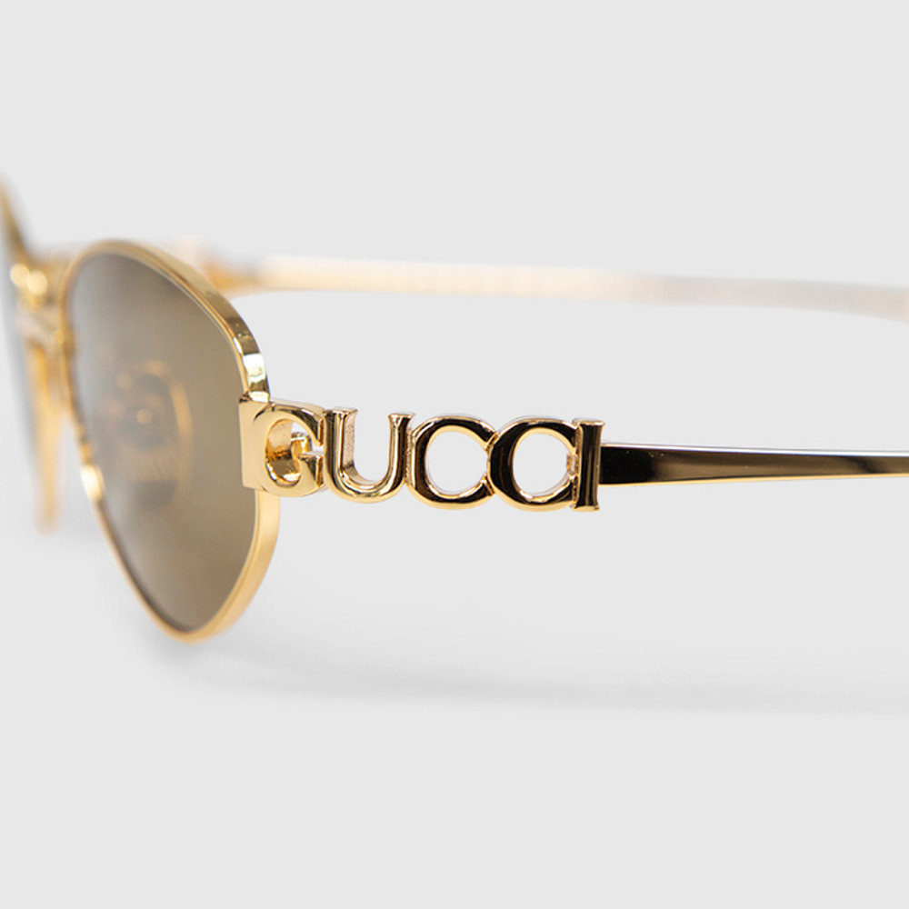 Second Hand Gucci Gold Metal Oval Logo Sunglasses