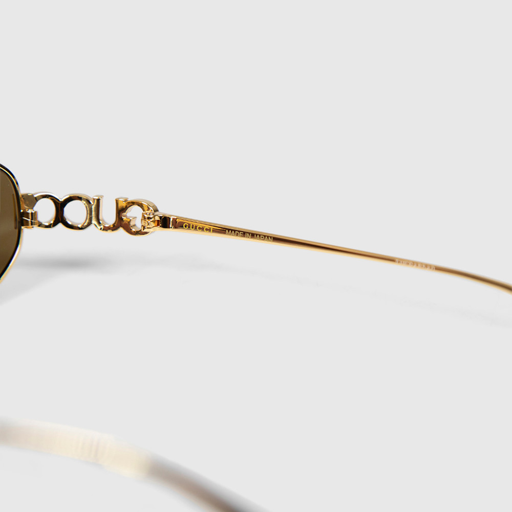 Second Hand Gucci Gold Metal Oval Logo Sunglasses