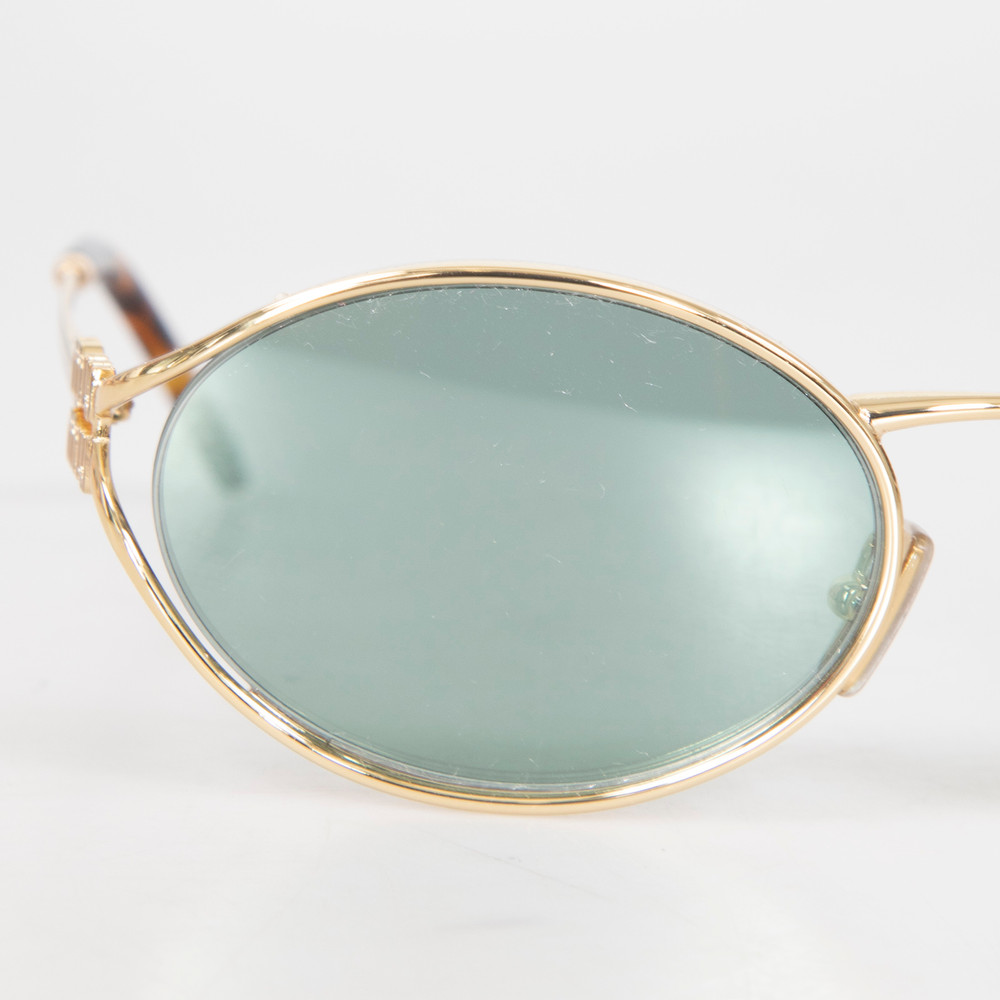Miu Miu Gold Frame Green Lenses Sunglasses