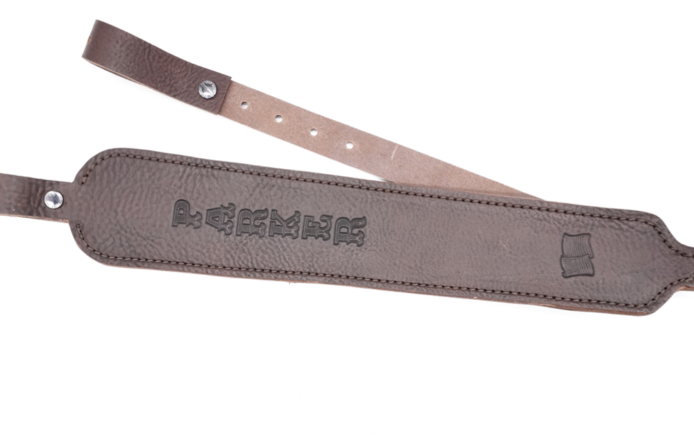 Custom leather rifle sling in chocolate brown.  Can be personalized with name or initials and also a custom stamp option. Cobra shape, cobra style rifle sling. hunting sling