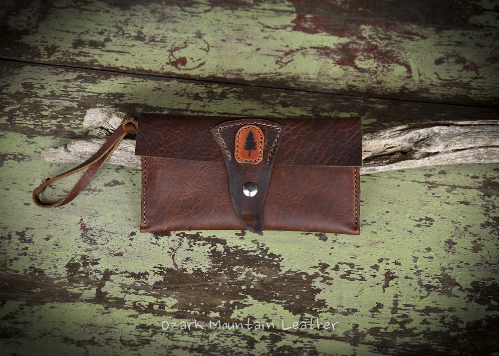 Bison leather clutch or wrist wallet.  Great travel wallet for hands free shopping.
