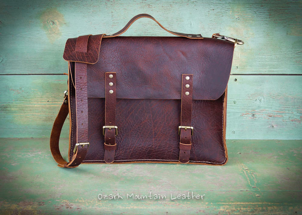 Bison leather messenger bag handmade by Ozark Mountain Leather in brown.  Perfect for business or school use.  Can be worn cross body or over the shoulder.