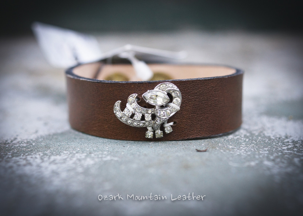 Vintage clear rhinestones on brown leather cuff.