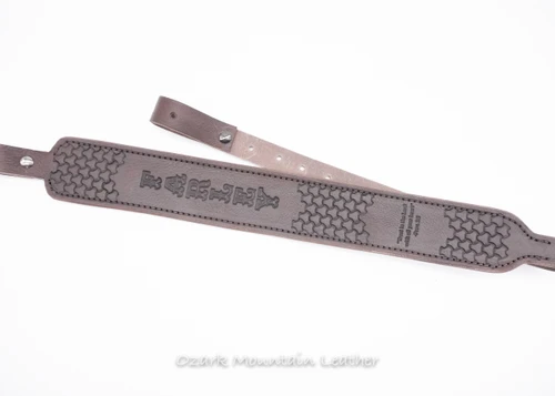 Custom hand tooled padded leather rifle sling made in the USA.  Custom gun sling with hand tooling you can add name and custom stamp to.  Makes a great gift idea.  Color in Chocolate brown.