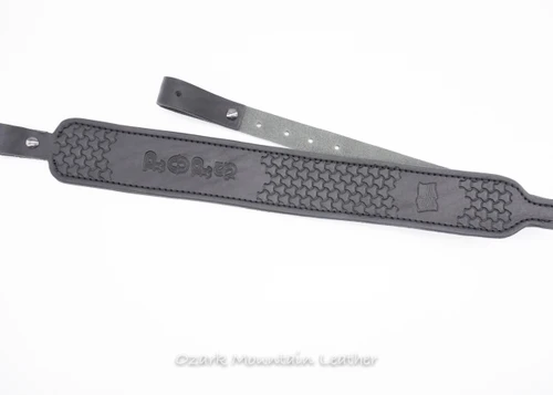 Custom black leather hand tooled padded leather rifle sling made in the USA.  Custom stamps available.  Custom name available.  Slim style gun sling in leather.  Shown in Black