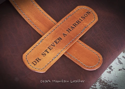 Leather portfolio satchel that can be customized with name or initials.  Made from Bison and vegetable tanned leather.  Great for photographers, doctors, lawyers and many other professionals that need to carry lots of paperwork with them. 