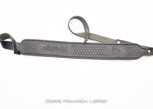 Custom leather shotgun rifle sling in black.  Can be personalized with name or initials and also a custom stamp option. Shotgun sling or sling for a gun without swivels. No drill rifle sling. Custom leather shot gun rifle sling in black.  Can be personalized with name or initials and also a custom stamp option.